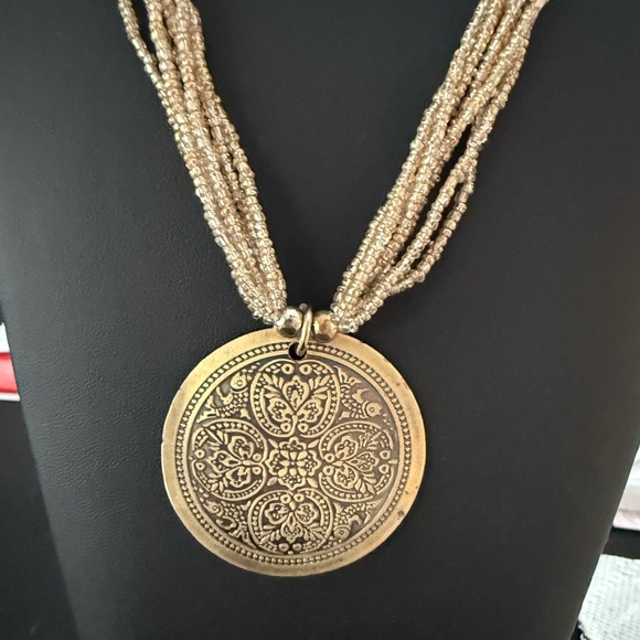 Tribal vintage gold tone 7 strand 16” beaded necklace with round pendant. - Picture 4 of 6